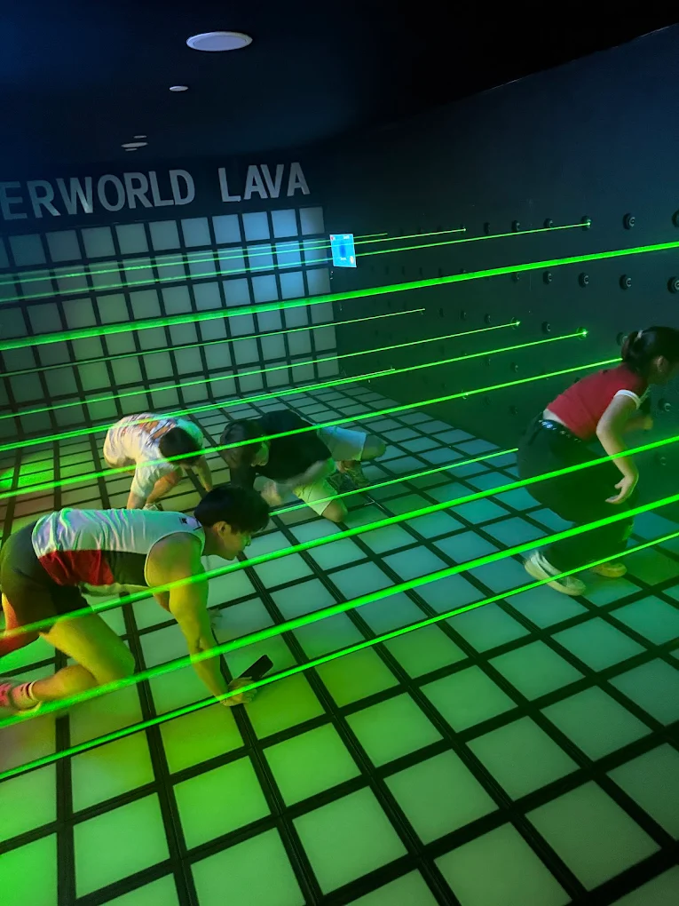 Laser Maze player navigating beams